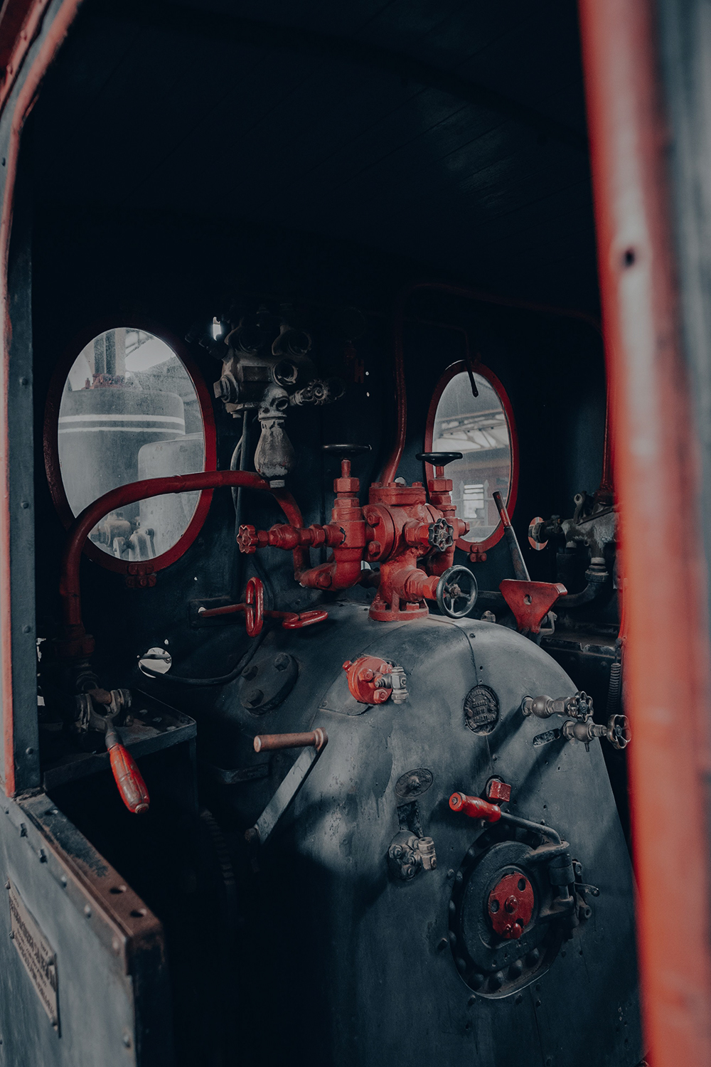 Hydraulic engineer carrying out diagnostics on industrial hydraulic equipment